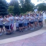 marching band leads the CLAS faculty toward their lunch